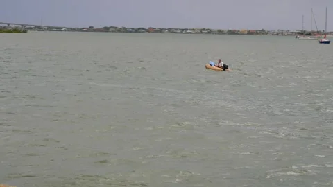Small boat moving right to left in Matanzas Bay east from Historic Castillo de S Stock Footage 311215039