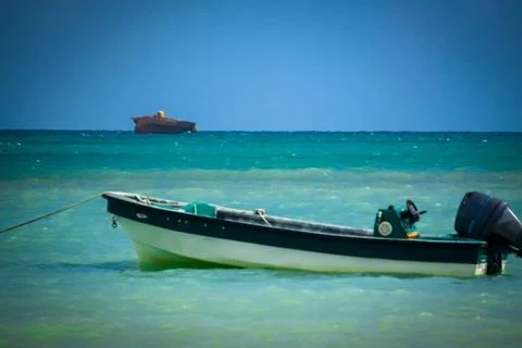 Small boat in the ocean Stock Photos