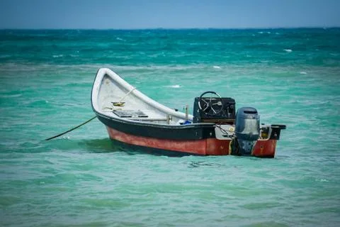 Small boat in the ocean Stock Photos
