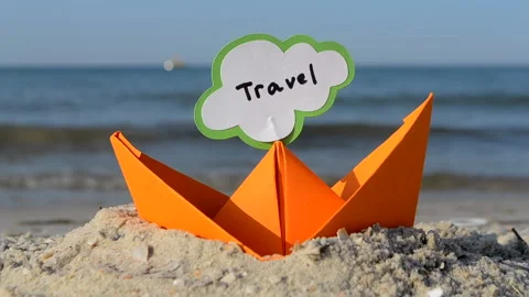 Small Boat from Paper on Background of Blue Sea on Sunny Summer day. Stock Footage 167510981