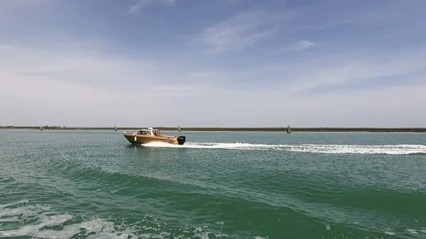 Small boat passing another boat Stock Footage 274638010
