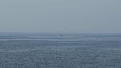 Small Boat Passing Far Away Horizon Sea Ocean Vídeos de archivo 148362140