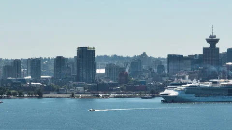 Small Boat Passing in Front of Downtown Vancouver Skyline and Cruise Ship Stock Footage 329399923