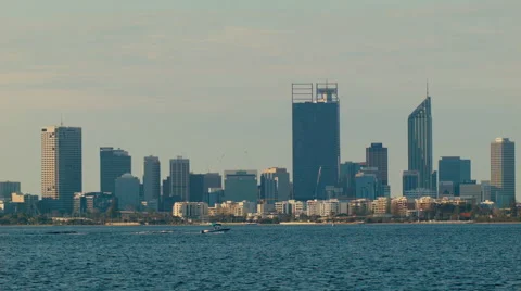Small Boat Passing the Perth City Skyline on the Swan River Stock Footage 48989441