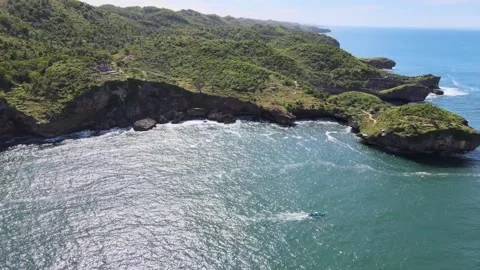 Small Boat Passing by Rocks Video stock 152501681