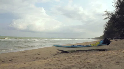 Small Boat on a Quiet Beach Stock Footage 66064597