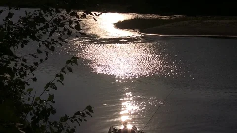 A small boat on the river, against a background of hilly landscape. Video stock 85215062
