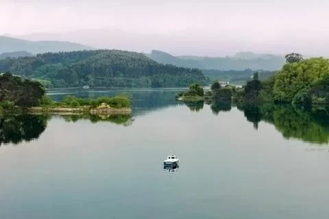 Small boat on the river 스톡 사진