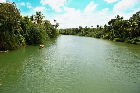A small boat in a river Stock Photos
