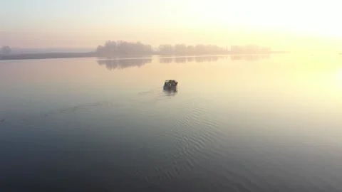 Small boat in the river in sunset light Stock Footage 146989366