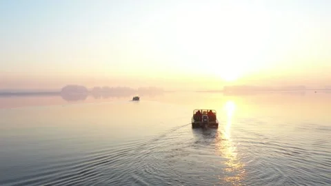 Small boat in the river in sunset light Stock Footage 146989516