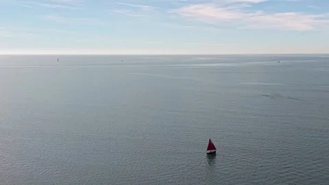 Small boat sailing across vast open water Stock Footage 339522596