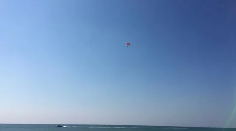 Small boat on the sea pulls the parachute Video stock 67765785