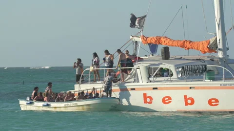 Small boat separating from the large boat in the Dominican Republic Stock Footage 50387604
