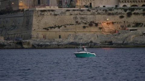 Small boat by the shore in Valletta Stock Footage 74816375
