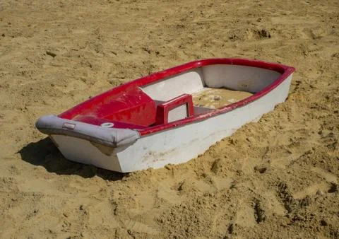 Small boat stranded in the sandpit Stock Photos