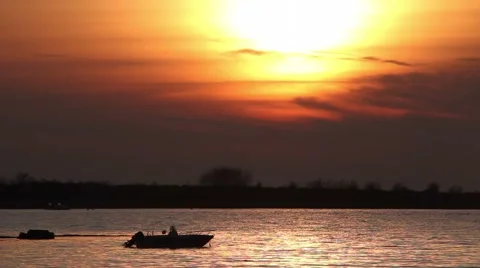 Small boat in the sunset Stock Footage 55878367
