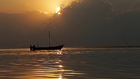 Small boat in sunset Stock Footage 79987258