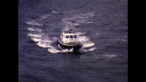 Small boat taking crew members from Ship 1968 Stock Footage 252831026