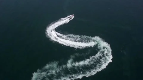 Small boat turning and tracking in the sea Stock Footage 234494461