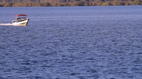 Small boat on water Stock Footage 39938541