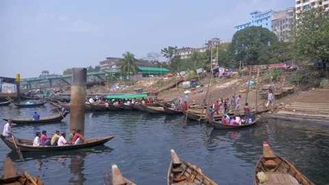 Small boats docking at Sadarghat river port in Dhaka Stock Footage 246292961