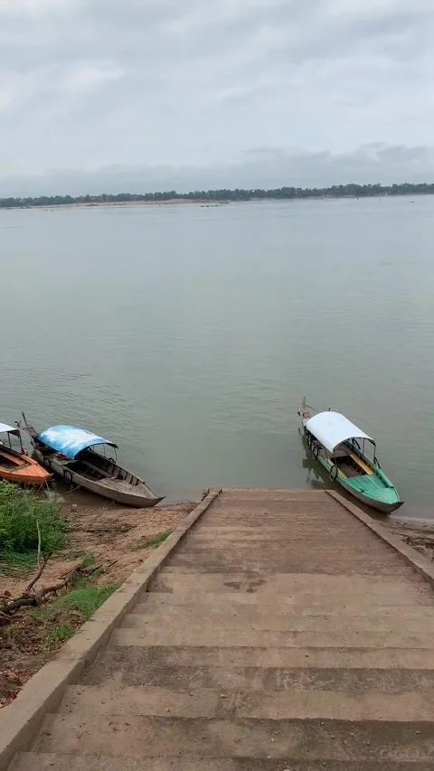 Small boats harbor on the Mekong river in Kratie region Stock Footage 340923711