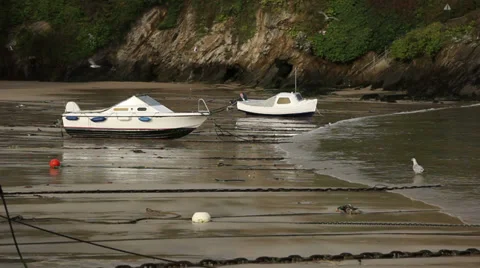 Small boats moared on the beach Stock Footage 33987142