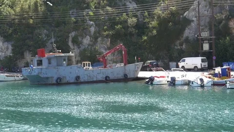 Small boats moored at the dock and large island 28 Stock Footage 71065194