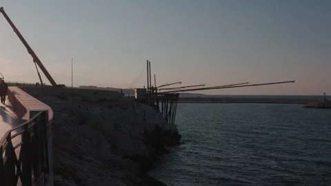 Small boats in sunset light. Harbour in Vieste, Italy. Vidéo 254333480