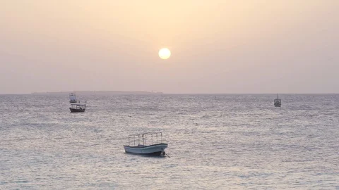 Small boats swing on the ocean waves Stock Footage 105457935
