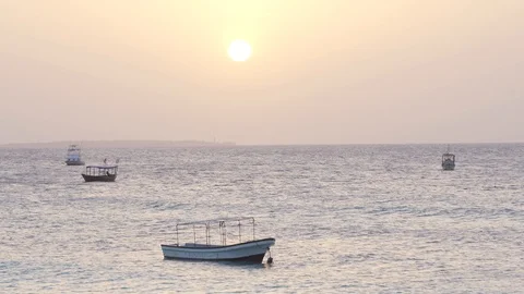 Small boats swing on the ocean waves Stock Footage 105457975