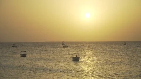 Small boats swing on the ocean waves Stock Footage 105458025