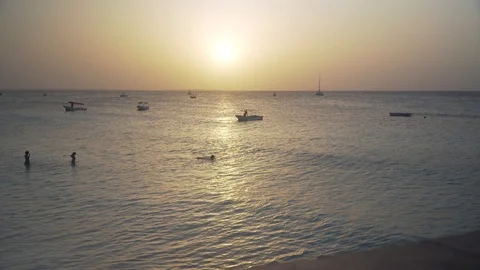 Small boats swing on the ocean waves Stock Footage 105458090