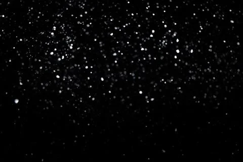 Small bokeh circles like snowfall on black background for overlay blending mode Stock Photos