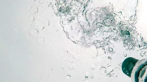 Small Bottle Dropped into  Quiet Pool of Water in Slow Motion. Video stock 49876461