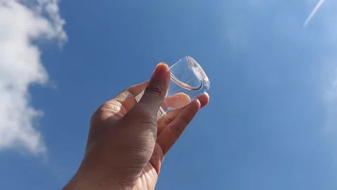A small bottle with a white lid containing mineral water or Zam Zam water Stock Footage 278204581