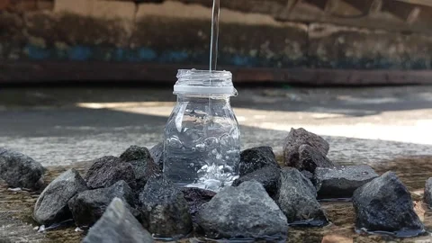 A small bottle with a white lid containing mineral water or Zam Zam water Stock Footage 278205066