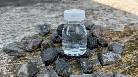 A small bottle with a white lid containing mineral water or Zam Zam water Stock Photos