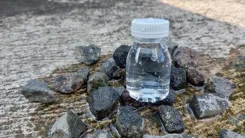 A small bottle with a white lid containing mineral water or Zam Zam water Stock Photos