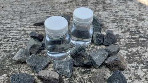 A small bottle with a white lid containing mineral water or Zam Zam water Stock Photos