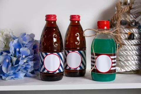 Small bottles with drinks are a place for a logo Stock Photos