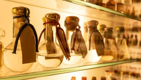Small bottles of grappa on the shelf Stock Photos