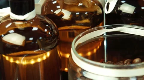 Small bottles with perfume and coffee on a show-window 動画素材 57852653