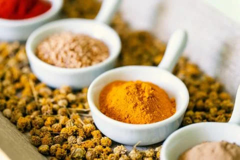 Small bowls with Dried spices. Stock Photos