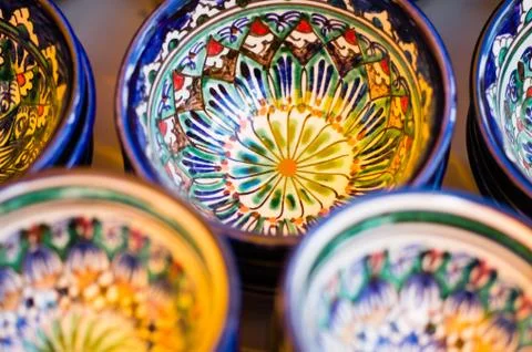 Small bowls with oriental-style patterns, painted with bright colors. Are on Stock Photos