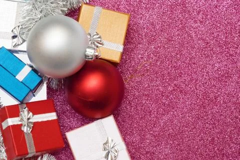 Small boxes for gift and two christmas ball on red Stock Photos