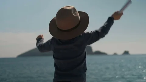 Small boy actively waving hands, calling his parents from sea Stock Footage 74698551