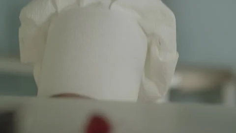 Small Boy in Chef Hat Piping Out from Kitchen Desk Stock Footage 159148215