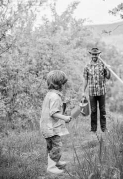 Small boy child help father in farming. happy earth day. Family tree nursering Stock Photos